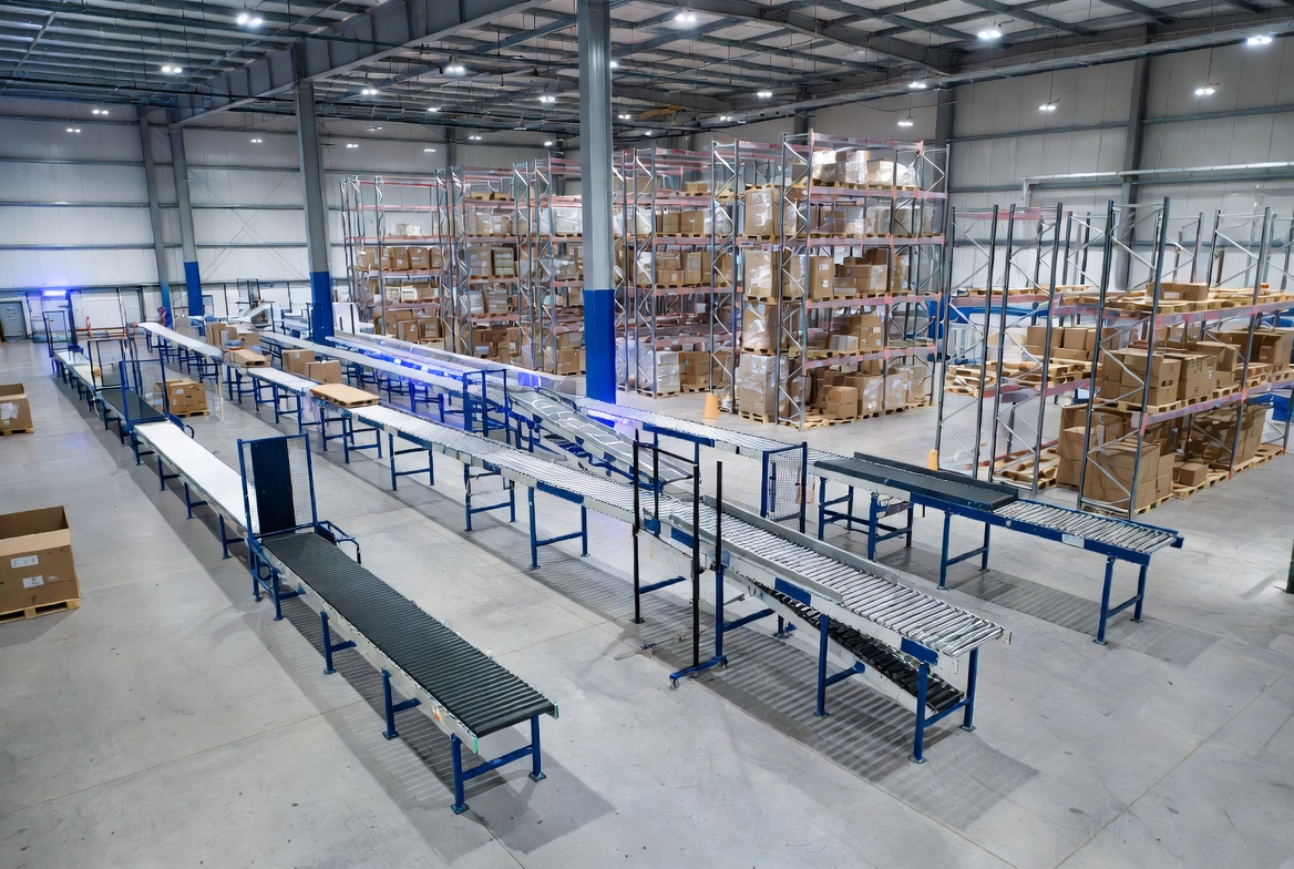 Modern conveyor system in manufacturing warehouse